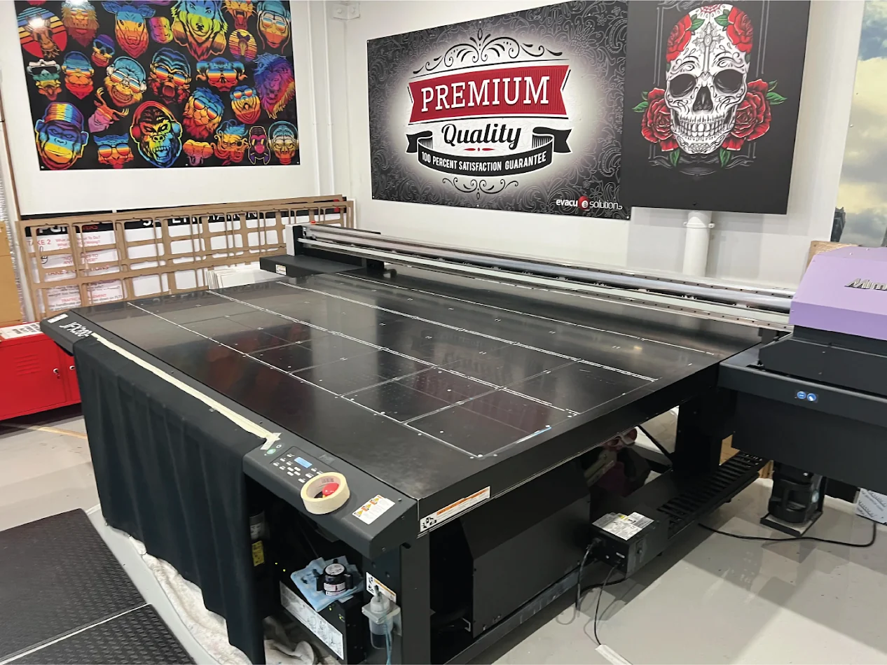 Evacu8 Solutions Mimaki UV flatbed printer in the Wakerley production workshop