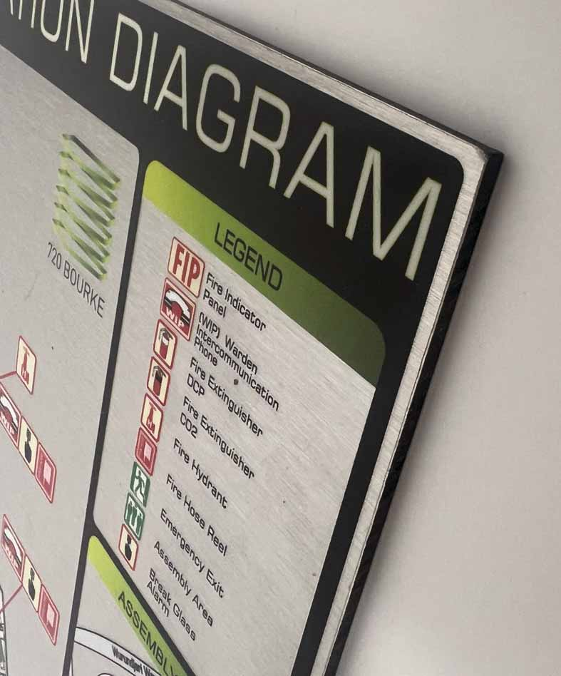 Close-up of a brushed aluminium composite evacuation diagram panel edge